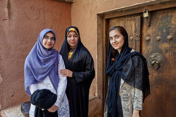 Three Iranian women in mountain village, Abyaneh, Iran.