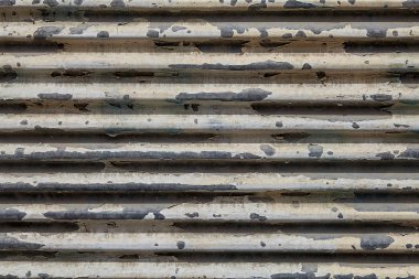 Soyulması boya, arka plan dokusu ile yıpranmış garaj kapısı.