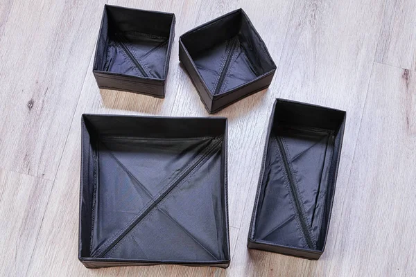 Set di scatole di stoffa pieghevoli nere . — Foto Stock