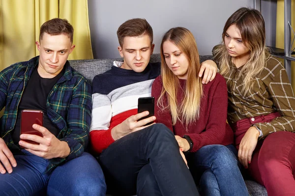 Small group of students in a college dorm.