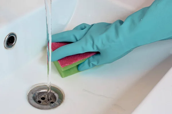 Cleaning in the bathroom. Cleaning the sink