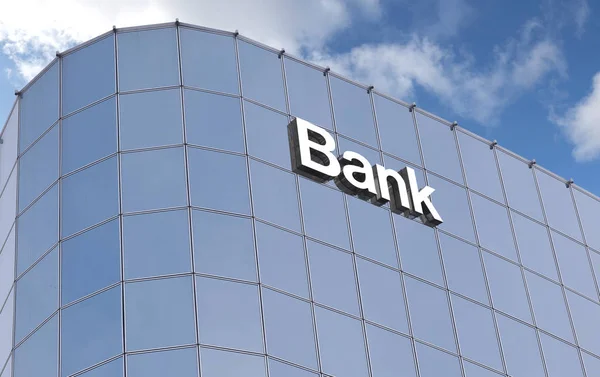 Gökyüzü arka planına karşı bir banka binasının cam duvarı