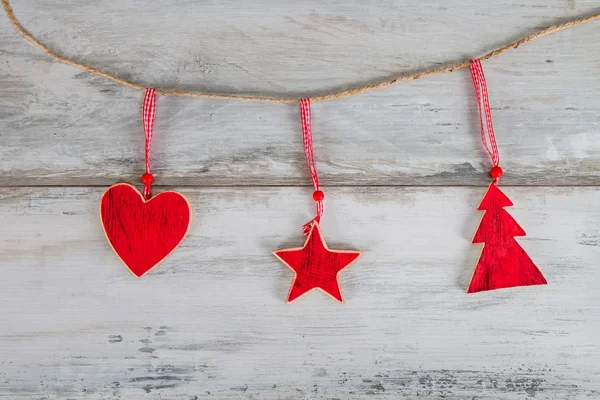 Christmas wooden decorations hanging — Stock Photo, Image