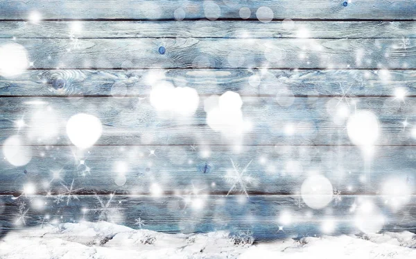Blå trä bakgrund med snöflingor — Stockfoto