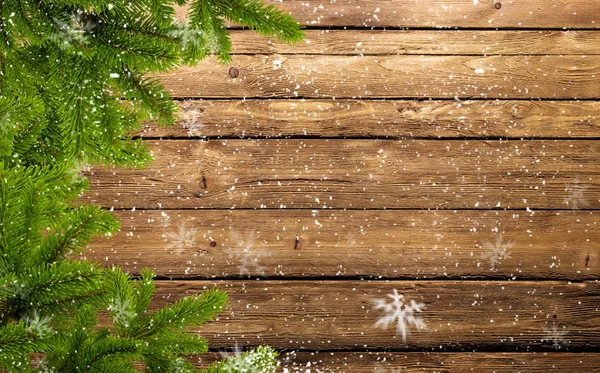 Stomme i fir grenar och snöflingor — Stockfoto