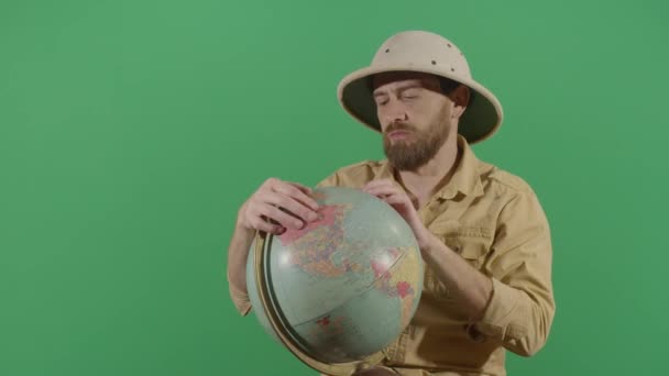 Adult Man Explorer Investigating A Globe — ストック動画