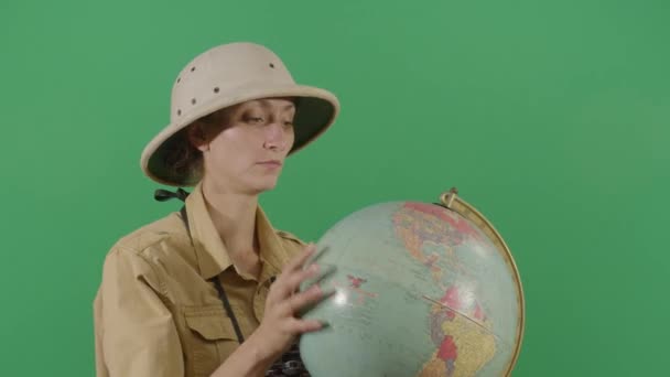 Woman Explorer Investigating A Globe — Stock Video