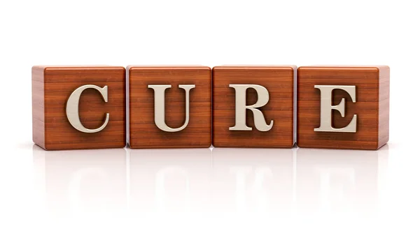 Cure text on wooden cubes — Stock Photo, Image