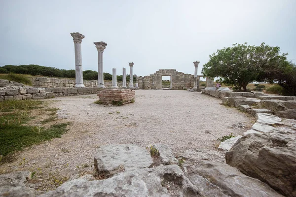 Ruins of the ancient Greek buildings on the Black Sea coast of Russia. Ancient Greek marble columns in Chersonesus Taurica. Sevastopol, Crimea.