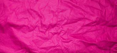 Kırışık kırmızı madde dokusu veya arkaplanı.