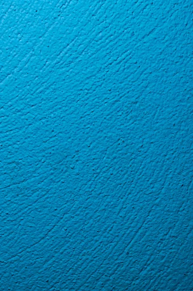 Muur in blauw geschilderd met zichtbare gipsen textuur — Stockfoto