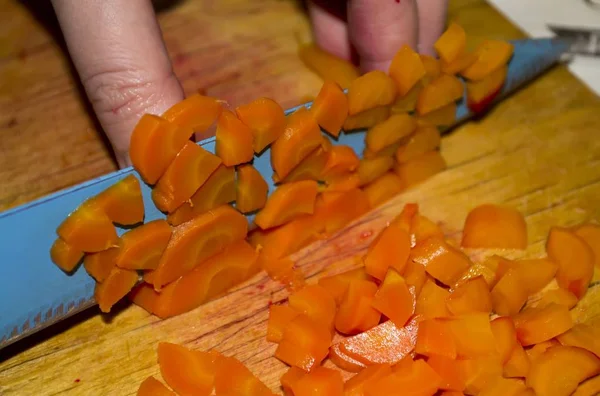 Sliced carrots. Cut into small pieces with a knife — 스톡 사진