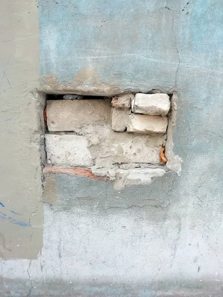 Wandtextuur met bakstenen gesloten raam — Stockfoto
