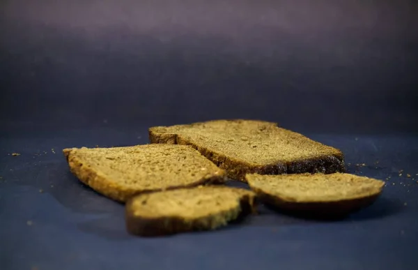 Pieces of bread on a dark gradient background