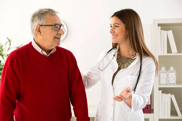 Senior man on consultation with doctor, close up — Stock Photo, Image