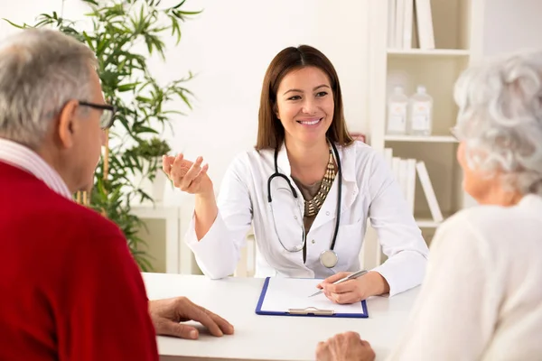 Senior couple on consultation with a doctor — Stock Photo, Image