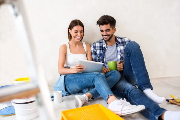 Relaxing after painting,couple renovation home — Stock Photo, Image