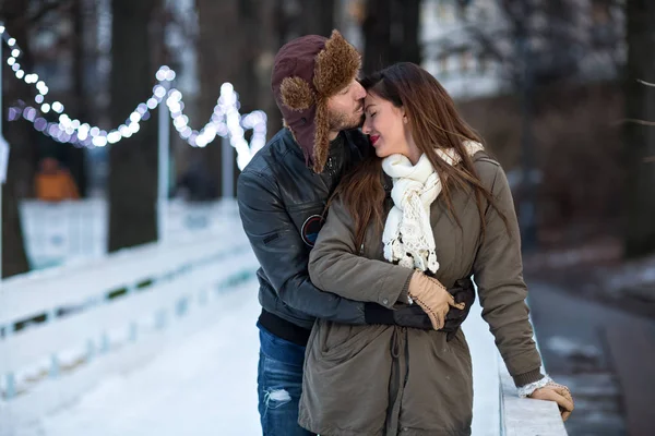 Loving couple kissing on a date in a ice rink — Stock Photo, Image