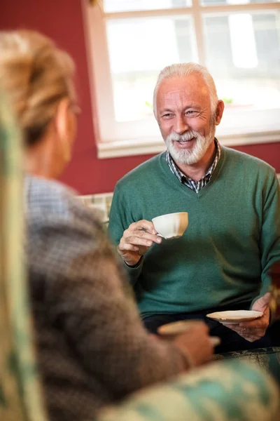 Smiling senior man talking with his friend at nursing home — Stok Foto