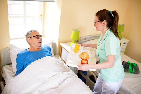 Compele a favor at nursing home — Stock Photo, Image