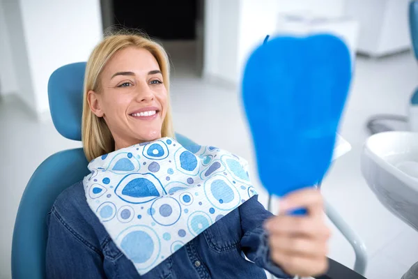 Smiling young beautiful woman at dentist ambulance