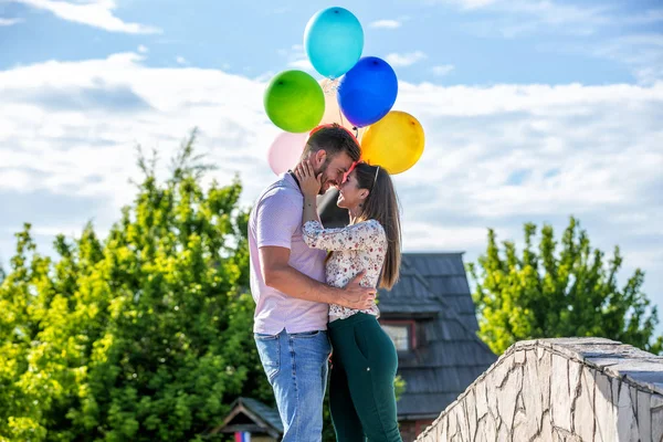 Romance under the colorful balloons — Stock Photo, Image