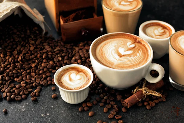 Pour latte art motives in espresso cups — Stok fotoğraf
