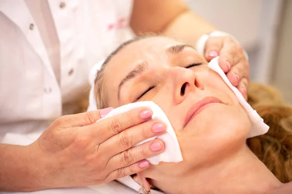 Cleaning of facial skin and preparing for a face massage — Stok fotoğraf