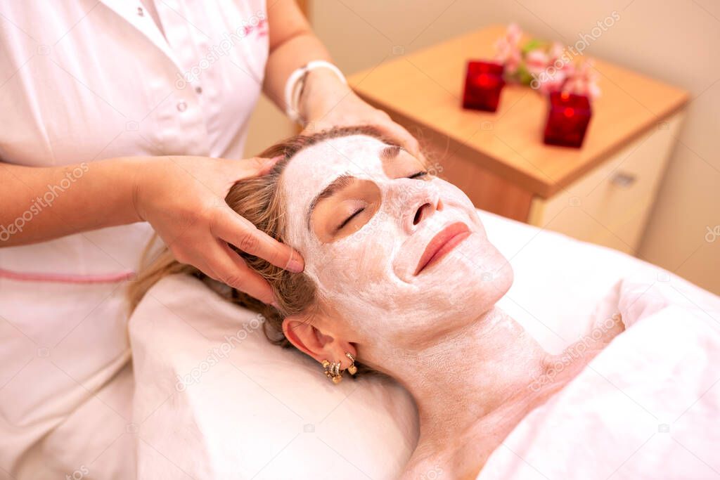 Cosmetics facial mask treatment in a beauty salon