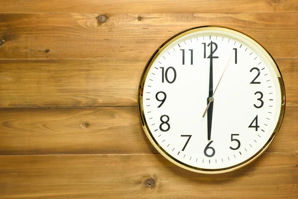 Wall clock on the wooden wall — Stock Photo, Image
