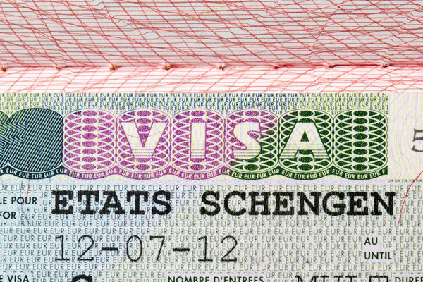 Schengen visa stamp oin pass — Stockfoto