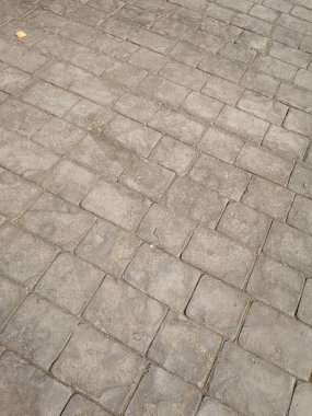 Çimento ya da havan yüzeyi bloğu şeklindeki kare desen kaba doku arkaplanına beton rengi sertleştirici yazdırma kalıpları damgala