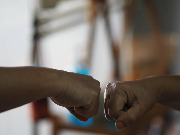 Alternative handshakes Hand to hand greeting in the situation of an epidemic covid 19, coronavirus