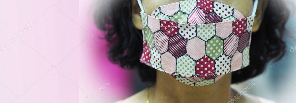 woman wearing face mask made form fabric self prevention ill for dust and germs pm 2.5, virus covid 19