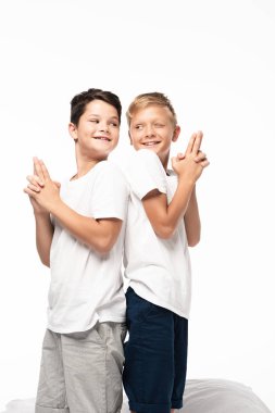 two cheerful brothers standing back to back and showing gun gestures isolated on white clipart