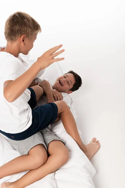 Overhead View Boy Sitting Laughing Brother While Having Fun Bed — Stock Photo, Image