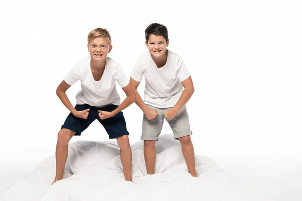 Two Cheerful Brothers Imitating Bodybuilders While Standing Bed Grimacing Isolated — Stock Photo, Image