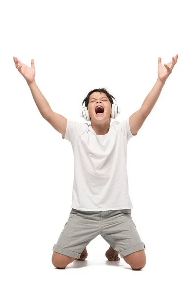 Excited Boy Standing Knees Raised Hands While Listening Music Headphones — Stock Photo, Image