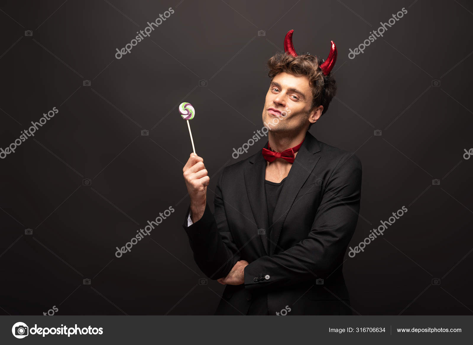 Handsome Man Halloween Devil Costume Holding One Lollipop Black Stock Photo by ©HayDmitriy 316706634
