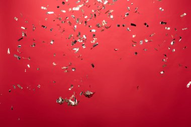 view of golden christmas confetti isolated on red clipart