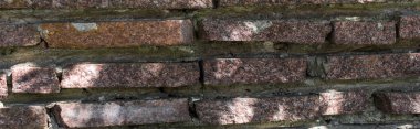Background of stone wall with concrete and sunlight, panoramic shot clipart