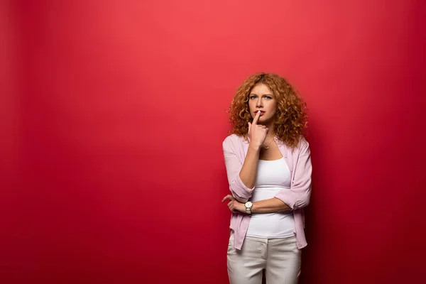 Beautiful Thoughtful Woman Red Curly Hair Isolated Red — Stock Photo, Image
