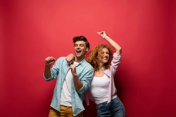 Beautiful Excited Couple Dancing Casual Clothes Isolated Red — Stock Photo, Image