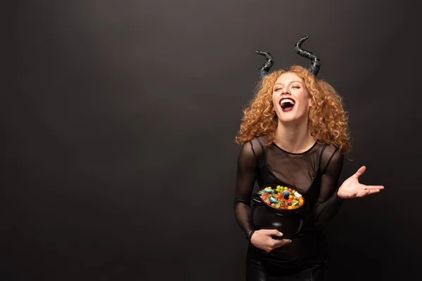 Laughing Woman Maleficent Costume Holding Pot Candies Halloween Black — Stock Photo, Image