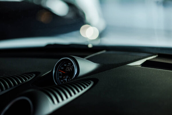 KYIV, UKRAINE - OCTOBER 7, 2019: selective focus of black speedometer in luxury porshe