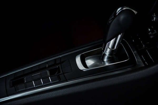 KYIV, UKRAINE - OCTOBER 7, 2019: selective focus of black changing gear in modern porshe