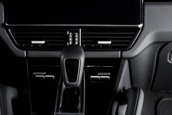 KYIV, UKRAINE - OCTOBER 7, 2019: black gear shift in new modern porshe