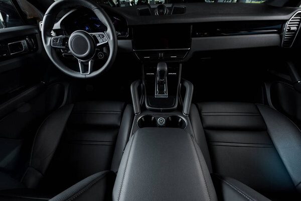 KYIV, UKRAINE - OCTOBER 7, 2019: leather car seats near steering wheel and gearbox in modern porshe