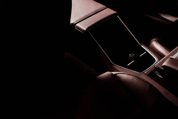 KYIV, UKRAINE - OCTOBER 7, 2019: sunshine on brown and leather car seats in modern porshe 