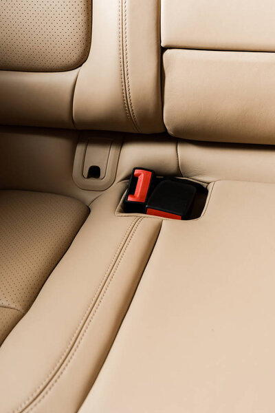 KYIV, UKRAINE - OCTOBER 7, 2019: sunshine on beige car seat in new luxury porshe 